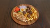 Falafel plate ,pita bread,chips, tomatoes and onions, dip humus